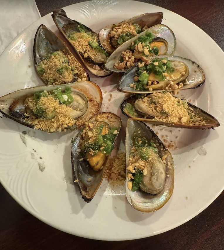 Grilled New Zealand mussels with scallion oil and peanuts
